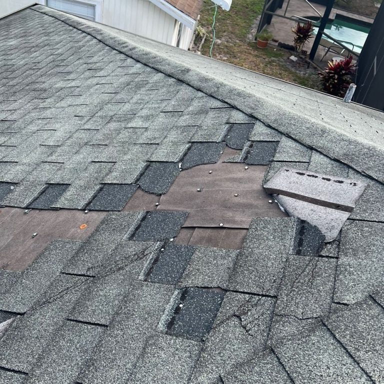 Photo of a storm-damaged roof repaired by Judd's Adjusting, illustrating successful claim resolution